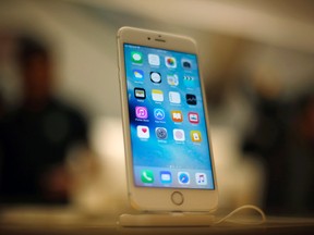 In this Sept. 25, 2015 file photo, a Apple iPhone 6S is displayed at an Apple store on Chicago. (AP Photo/Kiichiro Sato)