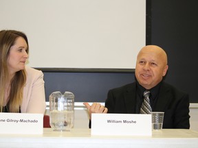 Former Iraqi refugee William Moshe shares his family's story while Roxanne Gilroy-Machado, of the YMCA Learning & Career Centre, listens in at Lambton College Thursday. The college's Centre for Social Justice organized a panel discussion on efforts to welcome Syrian refugees to Sarnia-Lambton. (Barbara Simpson, The Observer)