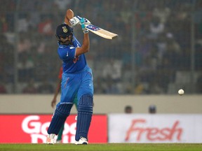 India's Rohit Sharma plays a shot against Bangladesh during the Asia Cup Twenty20 international cricket match in Dhaka, Bangladesh on Wednesday. (AP/A.M. Ahad)