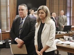 Sportscaster and television host Erin Andrews (right) stands with attorney Scott Carr as the jury enters the room during her civil trial in Nashville on Thursday, Feb. 25, 2016. (Alan Poizner/The New York Post/Pool via AP)
