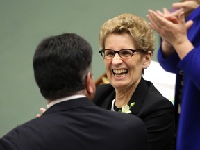 Premier Kathleen Wynne all smiles during reading of 2016 Budget at Queen's Park in Toronto Thursday, February 25, 2016. (Craig Robertson/Toronto Sun)