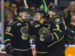 Left to right: Christian Dvorak, Mitchell Marner and Matthew Tkachuk celebrate after Marner opened the scoring during the first period of an OHL game against the Flint Firebirds in London on Feb. 15. (Derek Ruttan/Postmedia Network)