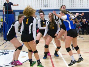 The Oakridge Oaks celebrate winning the WOSSAA AAA senior girls volleyball championship match over the Saunders Sabres at CCH on Thursday night. The Oaks prevailed in four sets, 25-14, 14-25, 25-21, 25-15.  (MIKE HENSEN, The London Free Press)