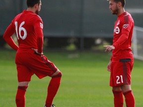 Toronto FC forward Herculez Gomez (16) and midfielder Jonathan Osorio (21) talk during a  break in the action in Wednesday’s 1-1 draw with the Montreal Impact at the Joe DiMaggio Sports Complex in Clearwater. (USA Today Sports)