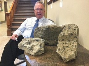 SUBMITTED PHOTO
Prince Edward County Mayor Robert Quaiff is pictured at Shire Hall with chunks of concrete he removed from County Road 49.