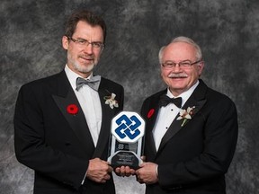 ASTECH:  Drs. Norman Kneteman and Lorne Tyrrell accept a 2012 ASTech Award for KMT Hepatec