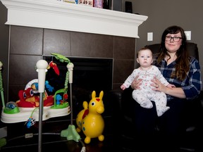 Brittany Chiles and her five-month-old daughter Eleanor in their home in Spruce Grove on Sunday, Feb. 21, 2016.  - Photo by Yasmin Mayne