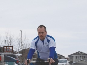Darcy Laniuk takes a spin on his bike as he prepares for the  200-km Ride to Conquer Cancer in August. He is now accepting pledges. - Photo by Marcia Love