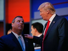 New Jersey Governor Chris Christie (L) talks to businessman Donald Trump during a commercial break in the midst of the first official Republican presidential candidates debate of the 2016 U.S. presidential campaign in Cleveland, Ohio in this August 6, 2015 file photo. Christie endorsed Republican presidential frontrunner Donald Trump on February 26, 2016, saying his former rival for the White House had the best chance at beating Democratic candidate Hillary Clinton in the general election. REUTERS/Brian Snyder/Files
