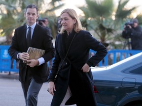 Spain's Princess Cristina arrives at court with her husband Inaki Urdangarin to attend trial in Palma de Mallorca, Spain, February 26, 2016. REUTERS/Enrique Calvo