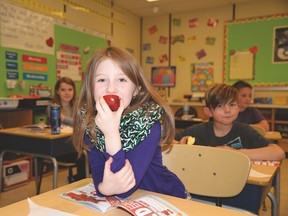 Students enjoy fruits and vegetables as part of a nutrition program. (Postmedia file photo)