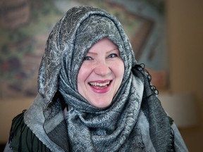 Ann Brown wears a hijab for the first time during Ottawa Hijab Solidarity Day at Ottawa City Hall.