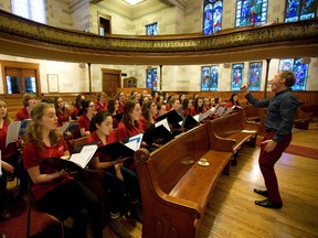 Kingston choral conductor Mark Sirett directs the Amabile Youth Singers at New St. James Presbyterian Church. (MIKE HENSEN, The London Free Press)