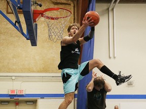 Dunking sensation Jordan Kilganon performs a number of dunks in front of students and staff at ƒcole secondaire du SacrŽ-Coeur in Sudbury, Ont. on Friday February 26, 2016. Kilganon is a graduate of the high school.