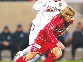 A young Michael Bradley, in action with the New York/New Jersey MetroStars, tries to defend against Chicago Fire's Chris Rolfe in a game in 2015. (Getty Images file photo)