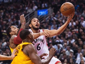 Toronto Raptors guard Cory Joseph drives to the net past Cleveland Cavaliers centre Tristan Thompson during first half NBA basketball action in Toronto on Friday, February 26, 2016. (THE CANADIAN PRESS/Nathan Denette)
