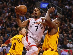 Toronto Raptors guard Kyle Lowry shoots the ball as Cleveland Cavaliers center Tristan Thompson defends in front of Cleveland Cavaliers guard Matthew Dellavedova at the Air Canada Centre. The Raptors won 99-97. (John E. Sokolowski/USA TODAY Sports)