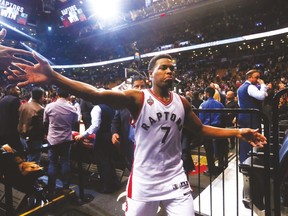 Kyle Lowry celebrates after the Raptors beat the Cavaliers 99-97 at the ACC on Friday. (Stan Behal/Toronto Sun)
