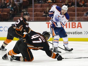 Taylor Hall skates against Ducks players during first period action Friday in Anaheim. (Getty Images)
