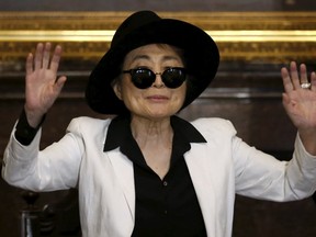 Artist Yoko Ono gestures before she was honored as 'Illustrious Visitor' by Mexico City's mayor Miguel Angel Mancera at Mexico City's town hall in Mexico City, February 3, 2016. REUTERS/Edgard Garrido