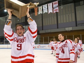 Medway?s John Wotherspoon proudly carries the trophy after the Cowboys claimed their first conference championship in boys hockey with a 4-1 win over the Oakridge Oaks in Game 3 of the TVRA Central final at Thompson arena on Friday night. Mike Hensen/The London Free Press