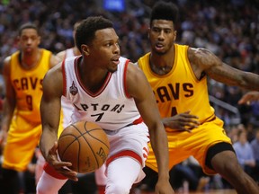 Toronto Raptors guard Kyle Lowry looks to pass the ball as Cleveland Cavaliers guard Iman Shumpert defends at the Air Canada Centre. (John E. Sokolowski/USA TODAY Sports)