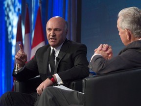 Kevin O'Leary speaks with Preston Manning during a session entitled "If I run here's how i'd do it" during a conservative conference in Ottawa Friday, February 26, 2016. THE CANADIAN PRESS/Adrian Wyld