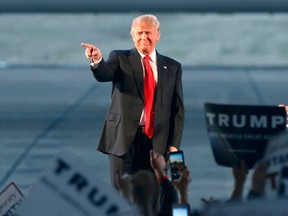 Republican U.S. presidential candidate Donald Trump points as he speaks to supporters during a campaign stop in Millington, Tennessee February 27, 2016.   REUTERS/Karen Pulfer Focht