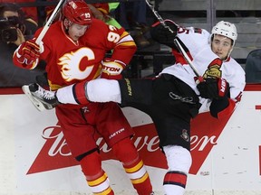 Calgary Flames' Sam Bennett collides with Senators defenceman Chris Wideman on Feb. 27. (Al Charest, Postmedia Network)