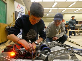Students work in the robotics lab at Western Technical-Commercial School. (Dave Abel/Toronto Sun/Postmedia Network)