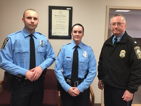 A photo provided by the Prince William County Police Department shows, from the left, Officer Steven Kendall, Officer and Ashley Guindon with Lt. Col. Barry Bernard, deputy chief of the Prince William County, Va., Police Department. Officer Ashley Guindon was shot and killed Saturday, Feb. 28, 2016, and two of her colleagues were wounded in a confrontation stemming from a call about an argument. Guindon and Kendall were sworn in on Friday, and Guindon was working her first shift with the Prince William County Police Department when she was killed. (Prince William County Police Department  via AP)