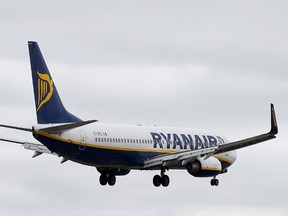 A Ryanair aircraft lands at Manchester Airport in Manchester, north-west England, Britain, May 26, 2015.   Ryanair nudged up its annual profit forecast on Monday, saying fuller planes would take profits to the upper end of its previously estimated range even as winter competition pressures average ticket prices. REUTERS/Andrew Yates