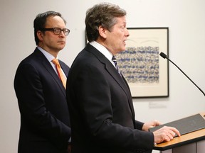 Toronto Mayor John Tory with Deputy Mayor Denzel Minan-Wong (left) updates media on the collapsed CUPE 79 city workers labour negotiations on Sunday, February 28, 2016. (Michael Peake/Toronto Sun)