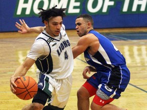 Branden Padgett of the Lambton Lions dribbles around Georgian Grizzles guard Zachary Marcelline during the Ontario Colleges Athletic Association men's basketball qualifying game at Lambton College on Saturday, Feb. 27, 2016 in Sarnia, Ont. Lambton won 84-76 to earn a spot in the OCAA championship next week in Toronto. Terry Bridge/Sarnia Observer/Postmedia Network