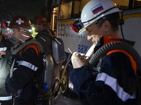 This Saturday, Feb. 27, 2016 photo provided by Russian Emergency Situations Ministry press service on Sunday, Feb. 28, 2016 shows rescuers from Kemerovo region arriving for help in Vorkuta, Russia. Russian officials say a total of 36 people are believed to have died at a coal mine where a methane gas leak triggered three explosions and the collapse of the mine. The Russian emergency services say the dead include five rescue workers and a mine worker who were killed when the third explosion rocked the Vorkutaugol mine in Russia's far north Komi region early Sunday. (AP Photo/Ministry of Emergency Situations press service via AP)