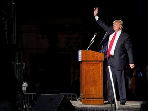 Republican presidential candidate Donald Trump waves after speaking during a rally at Millington Regional Airport in Millington, Tenn., Saturday, Feb. 27, 2016. (AP Photo/Andrew Harnik)