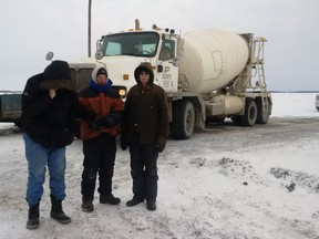 Farmers gathered to protest the latest round of Bipole construction on the weekend, arguing equipment poses the risk of spreading soil contamination. From
left to right, Jurgen Kohler, Tim Wiens, and Alvin Wiens were part of the human blockade. (Handout)