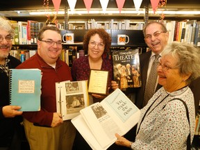 Coun. Garnet Thompson (second from right) stand alongside the Jourard family Mike Jourard (first left), Andrew Jourard, Tigger Jourard and Eleanor Jourard, during the unveiling of the Lee Jourard Memorial Theatre Collection at the Belleville Public Library Saturday.