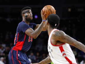 Detroit Pistons forward Reggie Bullock (25) attempts a shot against Toronto Raptors forward Terrence Ross (31) during the fourth quarter at The Palace of Auburn Hills. Pistons win 114-101. Raj Mehta-USA TODAY Sports