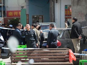 Police cordon off an area outside a primary school where 10 children were stabbed on Monday, in Haikou, Hainan province, Feb. 29, 2016.  REUTERS/Stringer