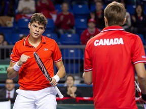 Canada's Milos Raonic, left, and Daniel Nestor celebrate a point while playing France's Julien Benneteau and Michael Llodra during the first set of a Davis Cup tennis doubles match in Vancouver, B.C., on Saturday, February 11, 2012. Raonic and Nestor will lead a veteran Canadian Davis Cup team in a first-round tie against France next month. THE CANADIAN PRESS/Darryl Dyck