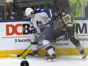 Kasperi Kapanen of the Toronto Marlies gets hit by Steve Olesky of the Wilkes-Barre/Scranton Penguins during AHL action at the Ricoh Coliseum in Toronto on Feb. 19, 2016. (Dave Abel/Toronto Sun)