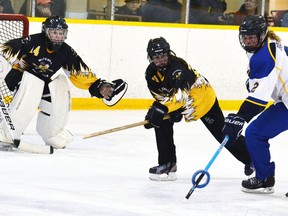 Forest’s Ashley Boere (2) tries to take a shot on Mitchell goalie Dani Hanson (left) as defender Khloee Eisler tries to block it during a WORL U16A ringette matchup last Saturday, Feb. 27, a 3-2 Forest victory. GALEN SIMMONS/MITCHELL ADVOCATE