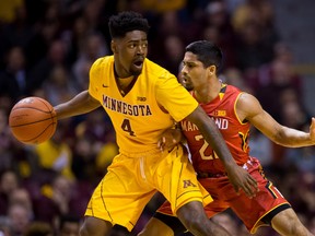 Minnesota Gophers guard Kevin Dorsey Jr. (4) dribbles the ball as Maryland Terrapins guard Varun Ram (21) defends in the frist half at Williams Arena. Brad Rempel-USA TODAY Sports