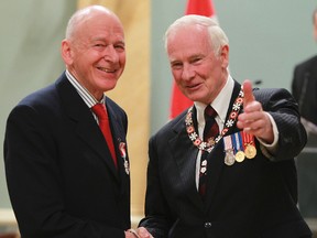 The Right Honourable David Johnston, Governor General of Canada, presents Stephen Clarkson of Toronto with the Order of Canada during an awards ceremony in Ottawa at Rideau Hall  May 27, 2011.(ANDRE FORGET/File Photos)