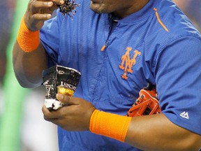 New York Mets third baseman Juan Uribe uses chewing tobacco during batting practice before the Mets played against the Miami Marlins in Miami in this Sept. 5, 2015, file photo. (Joe Skipper/AP Photo/Files)