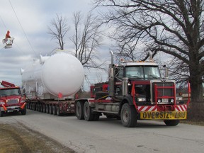 A crude styrene condenser exchanger, on route from Alliance Fabricating to INEOS Styrolution Canada's site, moves along Blackwell Road on Monday February 29, 2016 in Sarnia, Ont. Utility trucks and police escorted the oversize load Monday morning on its move from the Alliance Fabricating site on Chester Street to Styrolution. (Paul Morden/Sarnia Observer/Postmedia Network)