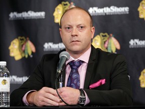 In this July 16, 2014, file photo, Chicago Blackhawks vice-president/GM Stan Bowman listens to the media during a news conference at the United Center in Chicago. (AP Photo/Nam Y. Huh, File)