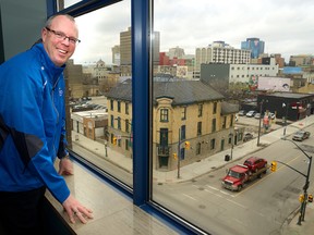 Steve Bolton, CEO of Libro Credit Union, shows off the view of York Street seen from the firm?s fourth-floor office. (MORRIS LAMONT, The London Free Press)