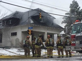This home on Walkley Road and another on Leitrim Road each sustained an estimated $300,000 in structural damage in fires on Sunday, Feb. 28, 2016. EVELYN HARFORD / POSTMEDIA